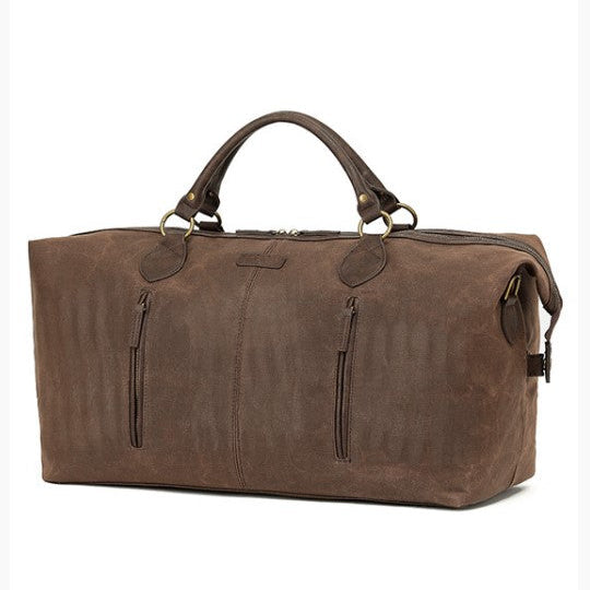 Brown leather duffel bag with handles and zippers on a white background