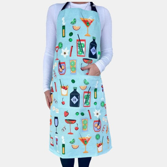 Person wearing a light blue apron with colorful cocktail illustrations on a white background