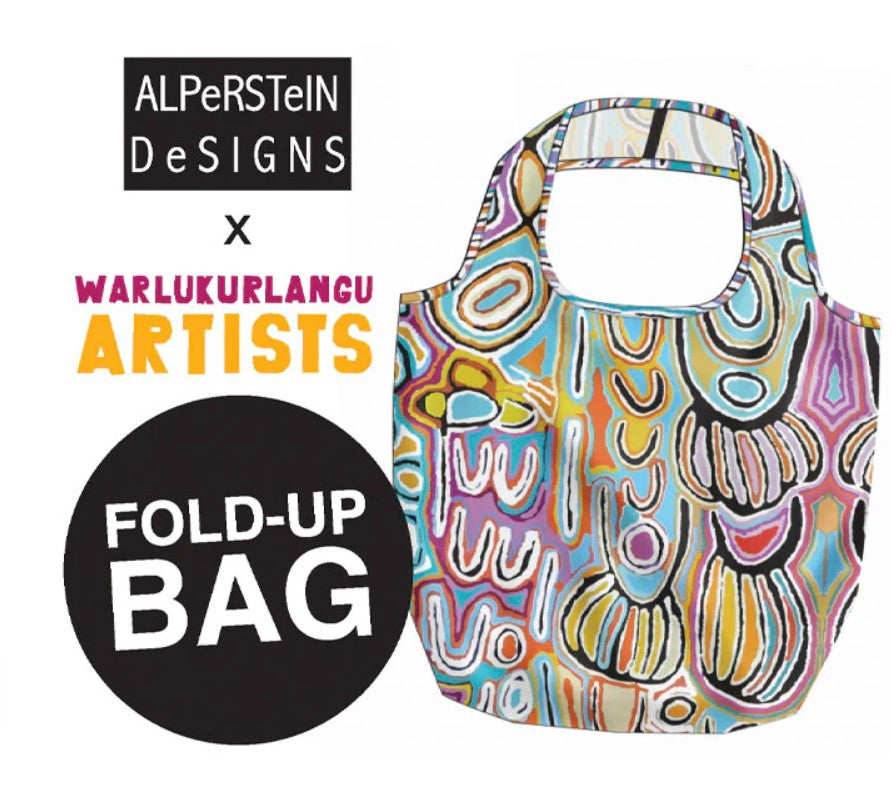 Colorful fold-up bag with Aboriginal art design, branded as AlpeRSteIN Designs x Warlukurlangu Artists.