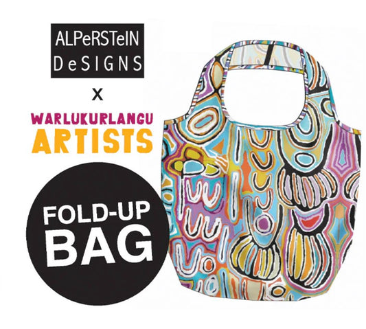 Colorful fold-up bag with Aboriginal art design, branded as AlpeRSteIN Designs x Warlukurlangu Artists.