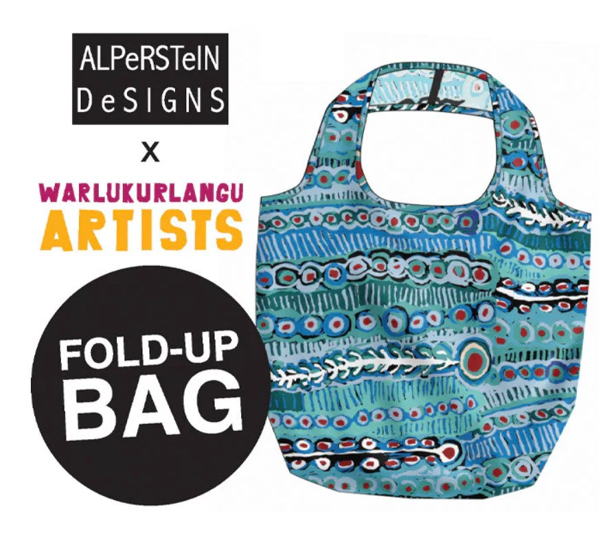 Fold-up bag with Aboriginal art design by ALPerSteIN Designs and Warlukurlangu Artists on a white background.