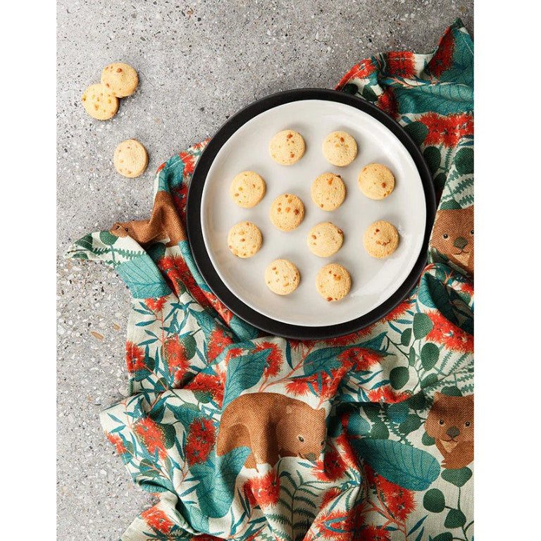 Plate of cookies on a decorative cloth with animal patterns