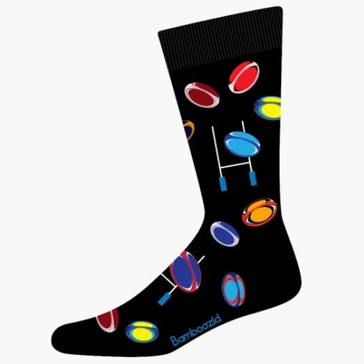 A single black crew sock with a colorful pattern of rugby balls.