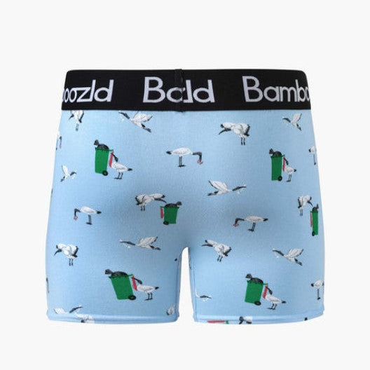 Light blue boxer briefs with a pattern of white cranes and green trash cans, featuring a black waistband with the brand name 'Bald' printed in white.