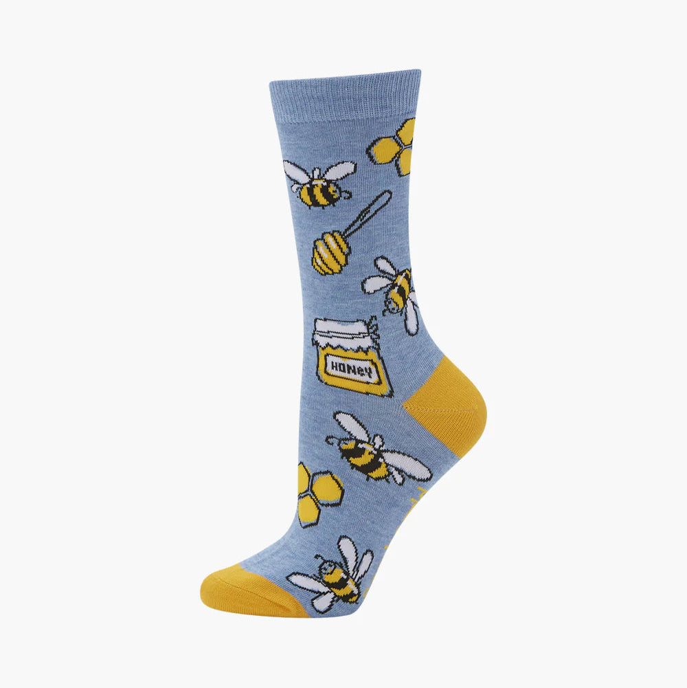 Blue sock with bee and honey design on a white background