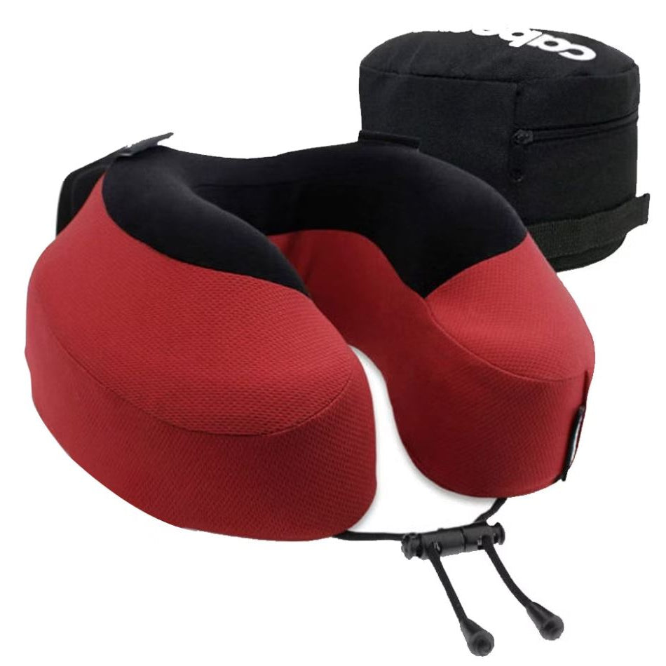 Red travel neck pillow with black carrying case on a white background