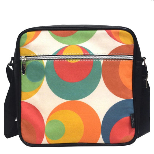 Colorful circular patterned bag with a black strap on a white background