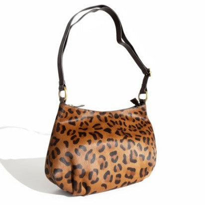 Leopard print handbag on a white background