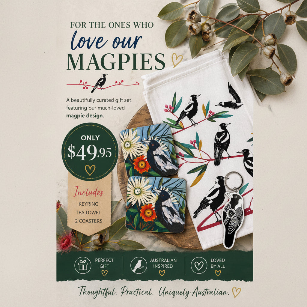Gift set with magpie design including keyring, tea towel, coasters on a wooden surface.