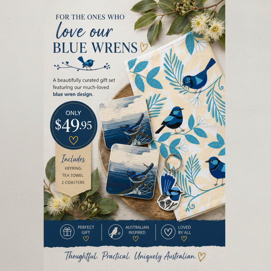 Set of coasters, keyring, tea towel with blue wren design on a wooden surface.