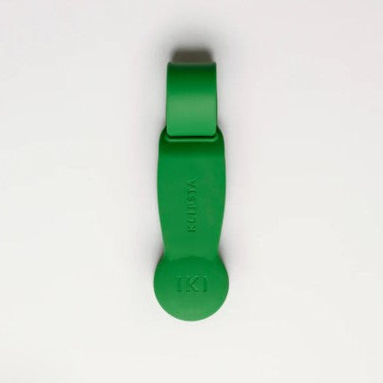 Green hat clip with a brand logo on a white background