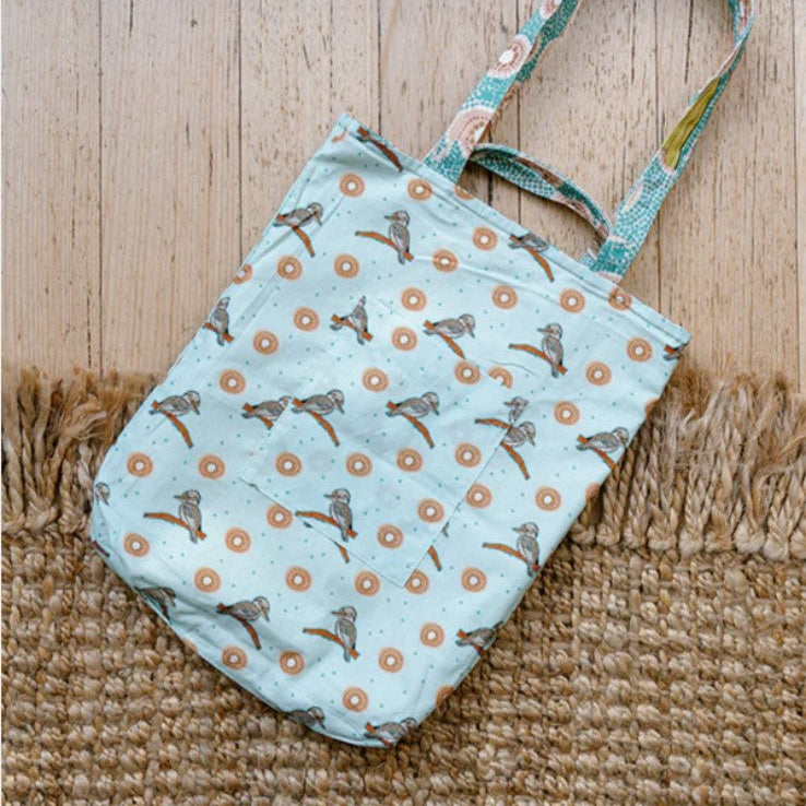Fabric pouch with bird pattern on a wooden surface