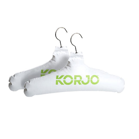 Two white hangers with 'Korjo' branding on a white background