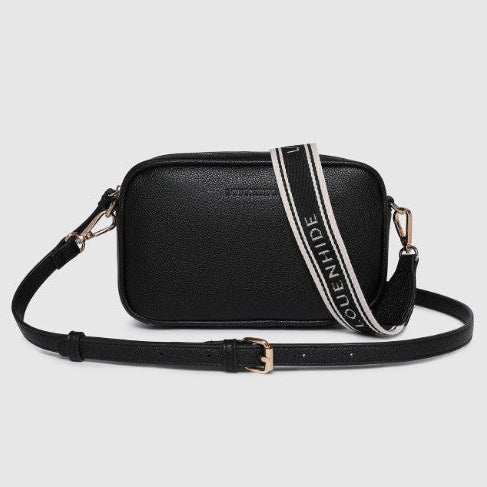 Black handbag with a strap featuring the brand name on a light gray background