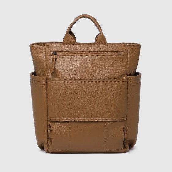 Brown leather backpack on a light gray background