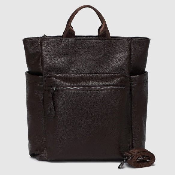 Brown leather backpack on a light gray background