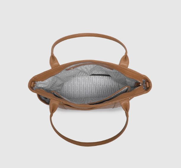 Brown handbag with open top on a light gray background