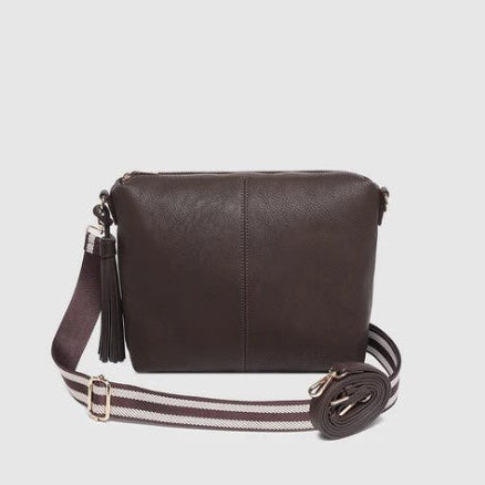 Brown crossbody bag with a striped strap on a light gray background