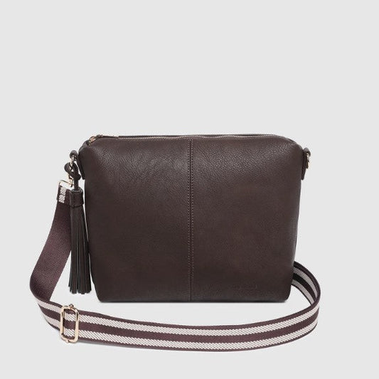 Brown crossbody bag with a striped strap on a light gray background