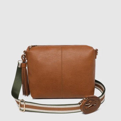 Brown crossbody bag with a strap on a light gray background