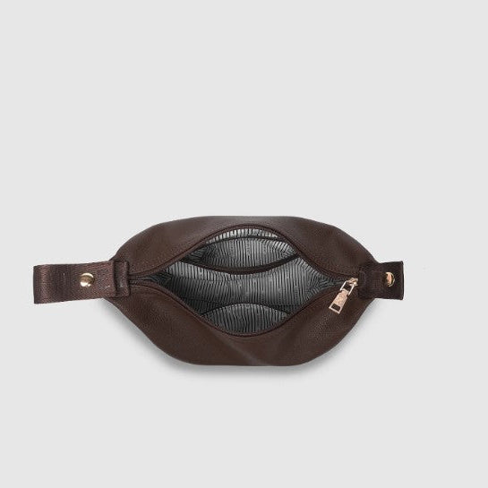 Brown cosmetic bag on a light gray background