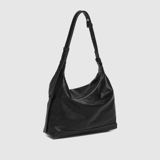 Black handbag on a light gray background