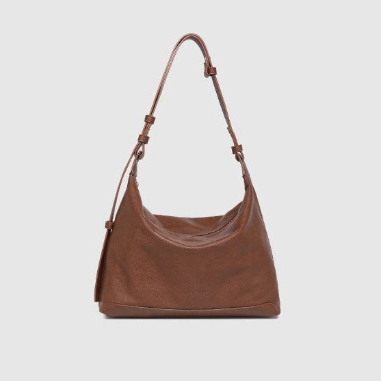 Brown handbag on a light gray background