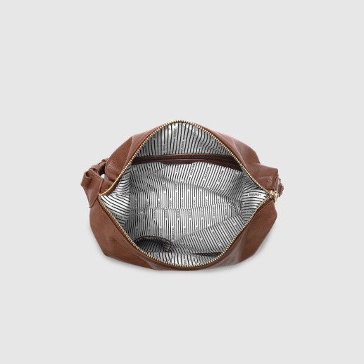 Brown bag with a zipper on a light gray background