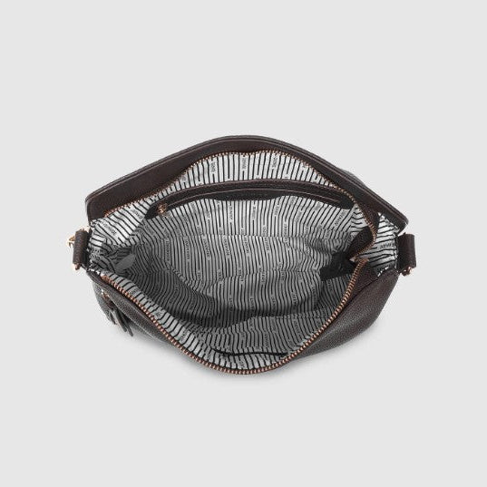Chocolate handbag with a clear interior on a light gray background