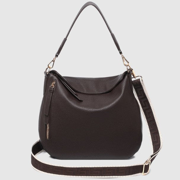 Chocolate handbag with a shoulder strap on a light gray background