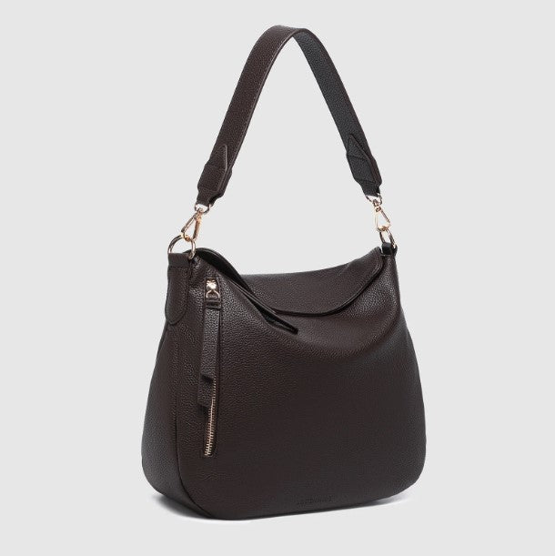 Chocalate handbag with a shoulder strap on a light gray background