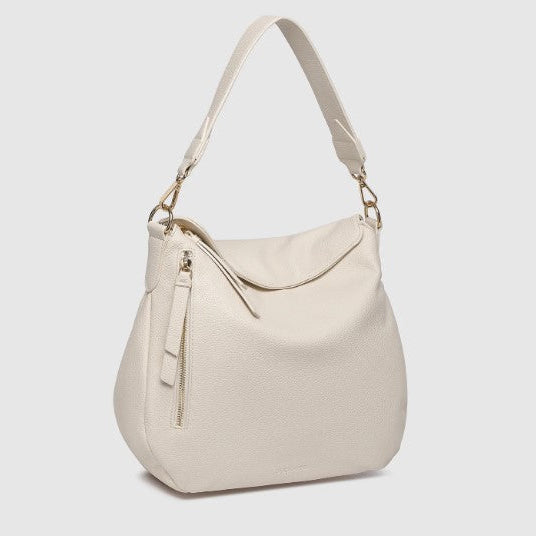 Beige handbag with a shoulder strap on a light gray background