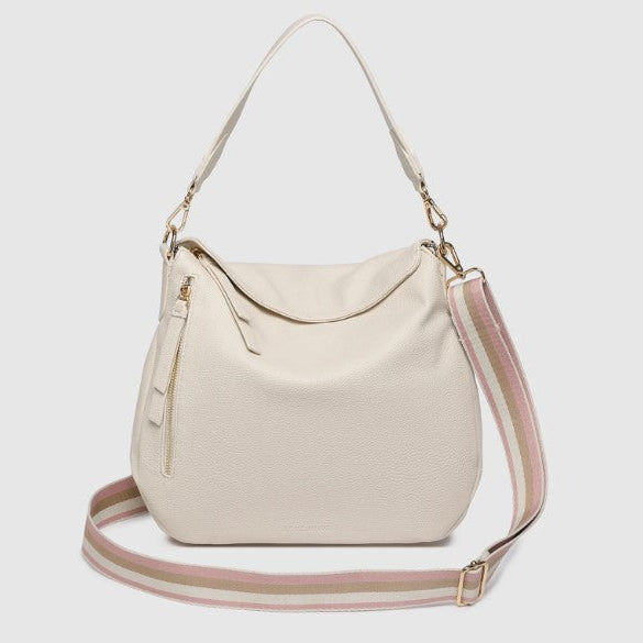 Beige handbag with a pink strap on a white background