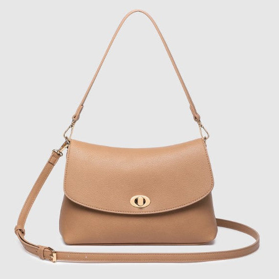 A tan shoulder bag with a curved flap, gold-tone turn-lock closure, and a matching adjustable shoulder strap, shown on a light gray background.