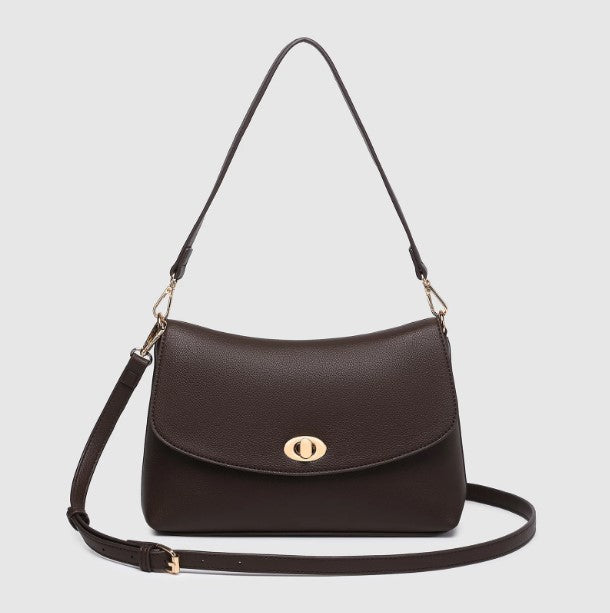A dark brown shoulder bag with a gold-tone oval turn-lock closure and a matching adjustable shoulder strap, displayed on a light gray background.