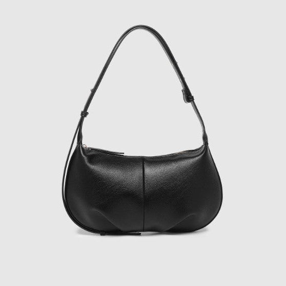 Black handbag on a light gray background