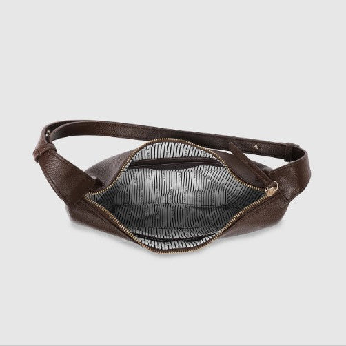 Brown leather waist bag on a light gray background