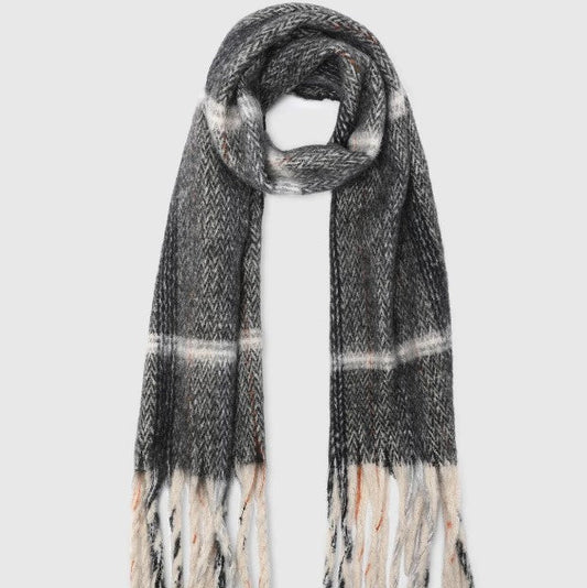 Plaid scarf with fringe on a white background