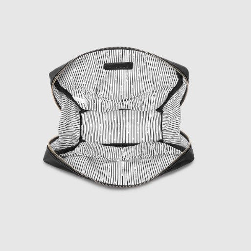 Black and white striped bag on a light gray background
