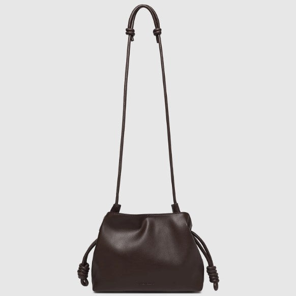 A dark brown leather shoulder bag with a long strap and knotted details, shown against a light gray background.