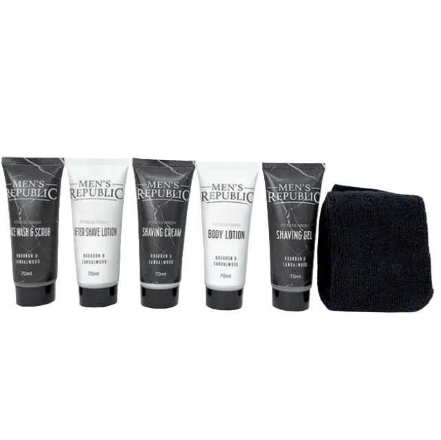 Men's grooming kit by Men's Republic featuring five 70ml tubes of shaving products in black and white packaging, alongside a black microfiber towel, arranged on a plain white background.
