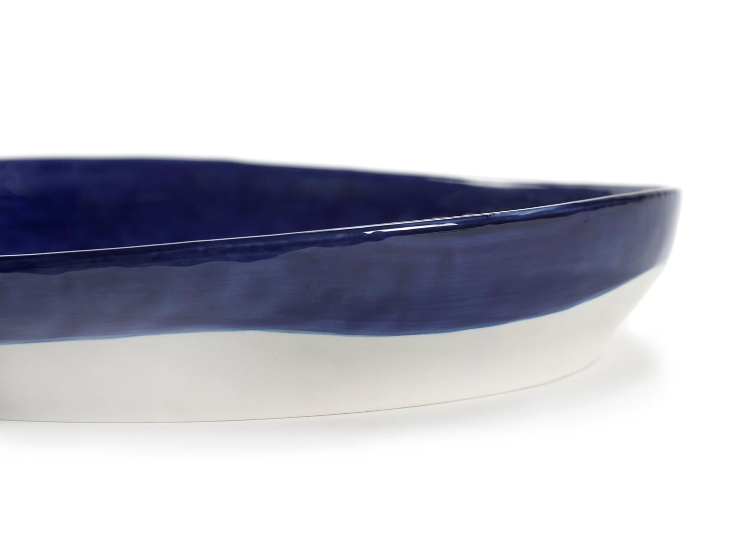 Blue and white ceramic dish on a white background