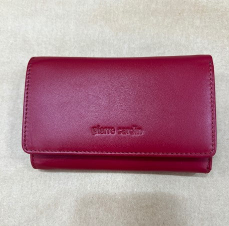 Red wallet with 'Pierre Cardin' branding on a light gray background