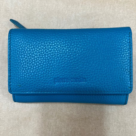Blue textured wallet on a beige background