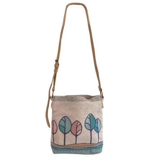 Crossbody bag with tree design on a white background