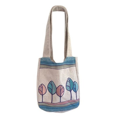 Tote bag with tree design on a white background