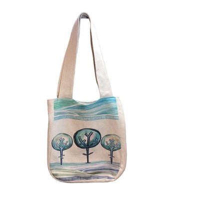 Tote bag with tree design on a white background