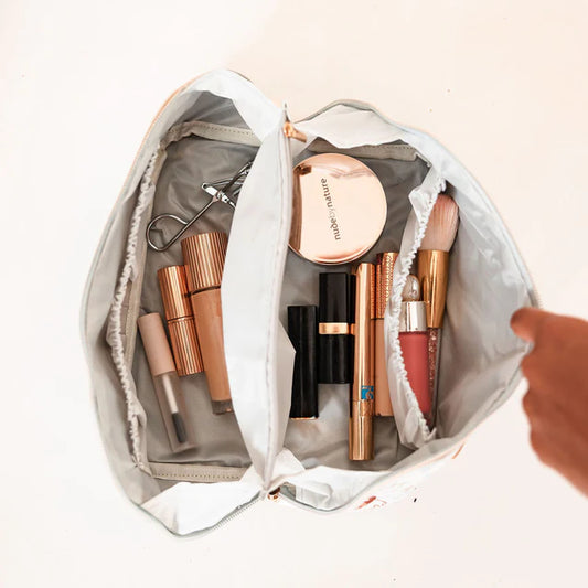 Easy-to-clean make-up organiser with vegan leather handle and smart storage.  Interior view.