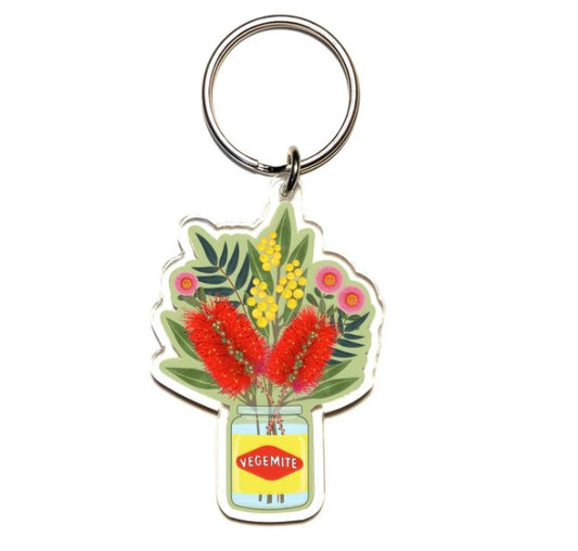 Keychain with Vegemite jar and floral design on a white background
