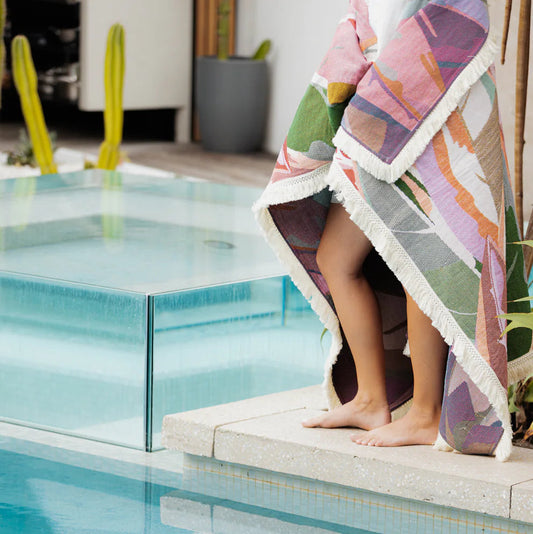 Sólsse Rug laid out for a family picnic, large and versatile outdoor blanket.  By the pool.